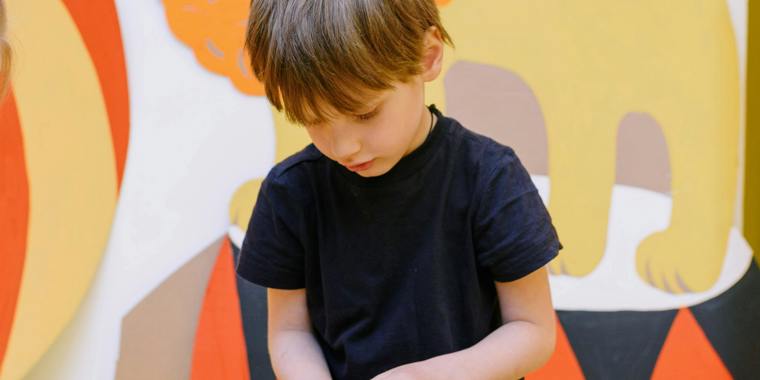 A young child absorbed in hands-on learning