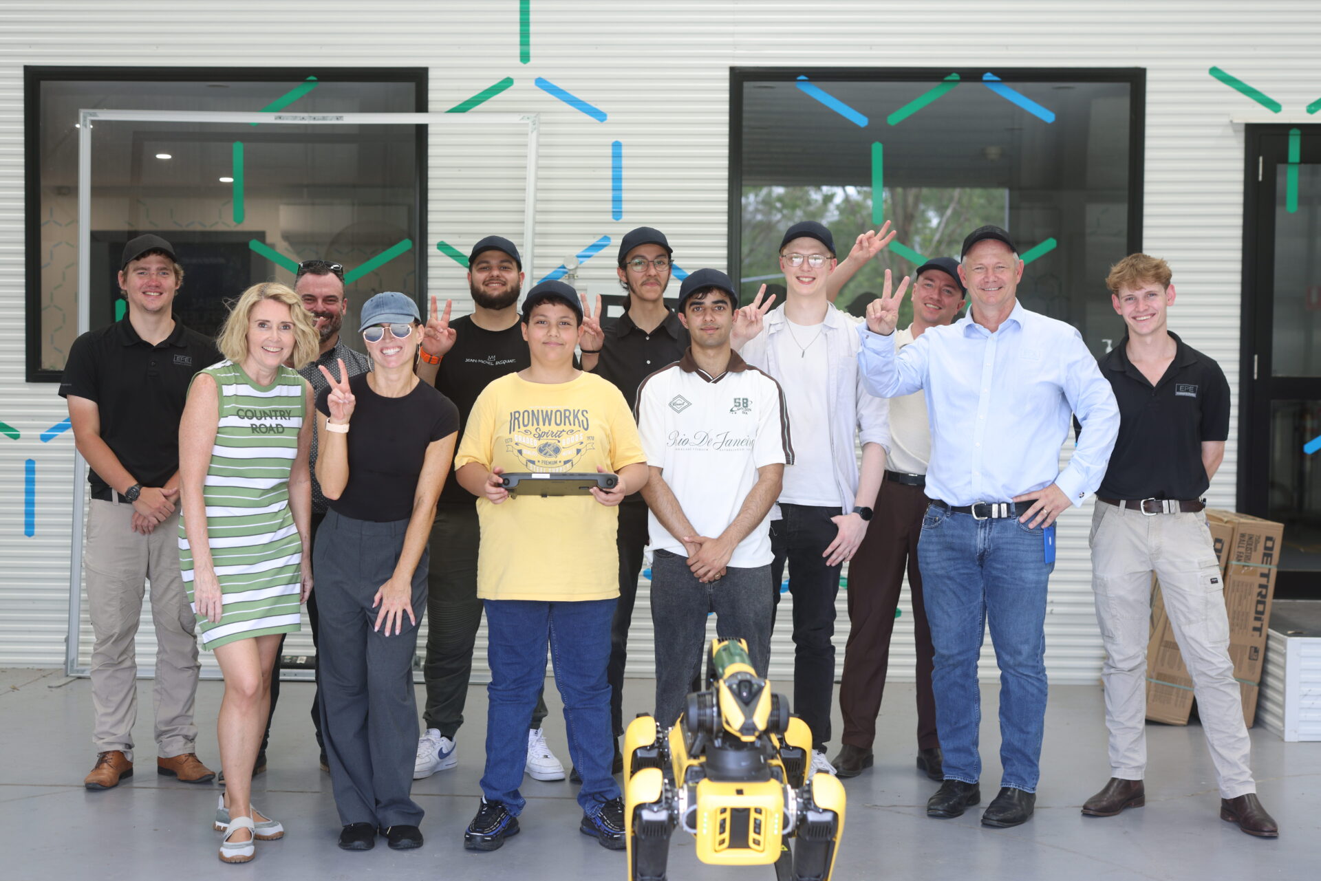 Group picture of our students, staff, EPE and Warwick Penrose with Spot the boston dymanic robotic dog.